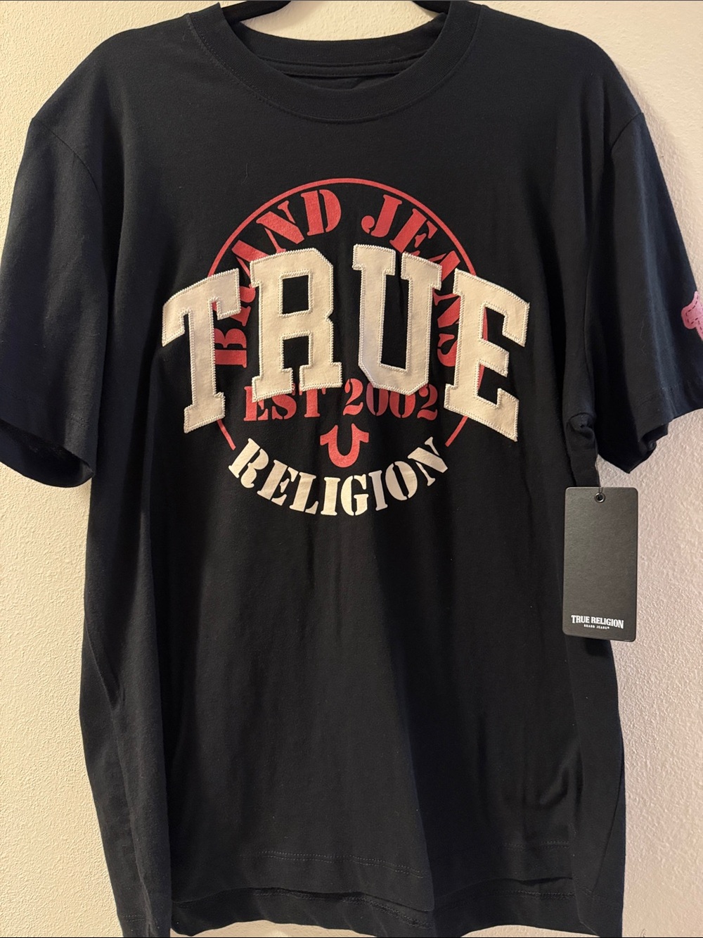 True Religion Black Tee with White 'TRUE' Patch and Red Emblem